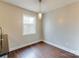 Bright dining area features a modern light fixture and a large window with natural light, complemented by elegant wood floors at 307 French St, Charlotte, NC 28216