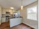 Updated kitchen with stainless steel appliances, modern cabinets, and sleek countertops at 307 French St, Charlotte, NC 28216