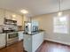 Updated kitchen with stainless steel appliances, modern cabinets, and sleek countertops at 307 French St, Charlotte, NC 28216