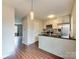 Modern kitchen featuring wood flooring, stainless steel appliances, and neutral paint at 307 French St, Charlotte, NC 28216