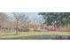 View of a charming brick house with a well-maintained lawn and a wooden deck for outdoor entertaining at 333 7Th Nw St, Hickory, NC 28601