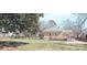 A serene backyard featuring lush green grass and a wooden deck for relaxation and enjoyment at 333 7Th Nw St, Hickory, NC 28601