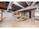 Unfinished basement with wood shelving and brick pillar at 333 7Th Nw St, Hickory, NC 28601