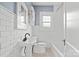 Charming bathroom with tiled walls, patterned floors, and vintage-style fixtures at 333 7Th Nw St, Hickory, NC 28601