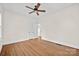 Neutral bedroom has hardwood floors and a ceiling fan at 333 7Th Nw St, Hickory, NC 28601