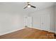 Spacious bedroom with hardwood floors, neutral paint, and ceiling fan at 333 7Th Nw St, Hickory, NC 28601