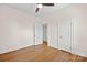 A bedroom featuring hardwood floors, ceiling fan, two doors and white trim at 333 7Th Nw St, Hickory, NC 28601