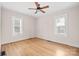 Bright bedroom with hardwood floors and two windows for ample natural light at 333 7Th Nw St, Hickory, NC 28601