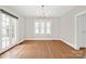 Elegant dining room featuring hardwood floors, a chandelier, and large windows for natural light at 333 7Th Nw St, Hickory, NC 28601
