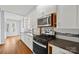 Modern kitchen with stainless steel appliances, white cabinets, and stylish backsplash detailing at 333 7Th Nw St, Hickory, NC 28601