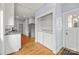 Bright open kitchen and laundry area with washer, dryer, and stainless steel refrigerator at 333 7Th Nw St, Hickory, NC 28601