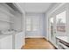 Bright laundry room with washer, dryer, and French door to back deck at 333 7Th Nw St, Hickory, NC 28601