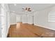 Inviting living room with hardwood floors, a ceiling fan, and multiple entryways to other rooms at 333 7Th Nw St, Hickory, NC 28601