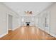 Spacious living room featuring hardwood floors, a fireplace, and a ceiling fan for added comfort at 333 7Th Nw St, Hickory, NC 28601