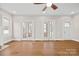 Bright living room boasts hardwood floors, white trim, a fireplace, and access to the front porch at 333 7Th Nw St, Hickory, NC 28601