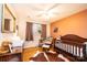 Cozy room with a crib, wood floor and a patterned rug for a comfortable and inviting space at 4238 Johnson Bridge Rd, Hickory, NC 28602