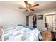 Bedroom with ceiling fan, closet, bed with blue accents, and a bathroom that offers convenience and comfort at 4238 Johnson Bridge Rd, Hickory, NC 28602