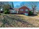 Charming brick home featuring a well-maintained front yard and attached garage at 4238 Johnson Bridge Rd, Hickory, NC 28602