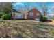 Charming brick home featuring a well-maintained front yard and attached garage at 4238 Johnson Bridge Rd, Hickory, NC 28602