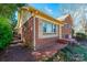 Charming exterior featuring a brick facade, well-maintained landscaping and stone accents at 4238 Johnson Bridge Rd, Hickory, NC 28602