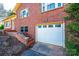 Attached garage with steps to front door in updated red brick home at 4238 Johnson Bridge Rd, Hickory, NC 28602