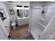 Modern bathroom featuring a double sink vanity, sleek fixtures, and a convenient walk-in shower at 4317 Ruskin Dr, Charlotte, NC 28209