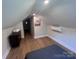 Cozy bedroom with hardwood floors, neutral walls, and storage solutions at 4317 Ruskin Dr, Charlotte, NC 28209