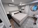 Serene bedroom featuring a comfortable bed, modern decor, and soft lighting at 4317 Ruskin Dr, Charlotte, NC 28209
