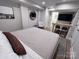 Spacious bedroom featuring a cozy bed, breakfast bar, and open bathroom view at 4317 Ruskin Dr, Charlotte, NC 28209