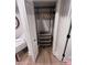 Open closet with chrome shelving and wooden hangers in a well-lit room, offering lots of storage at 4317 Ruskin Dr, Charlotte, NC 28209