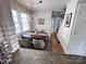 Bright dining room features a modern chandelier, wood table, and large windows at 4317 Ruskin Dr, Charlotte, NC 28209