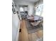 Open-concept dining area showcasing a wood table and bar seating to the adjacent kitchen at 4317 Ruskin Dr, Charlotte, NC 28209