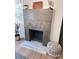 Close up on a fireplace with gray concrete blocks and stylish decor at 4317 Ruskin Dr, Charlotte, NC 28209
