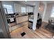 Modern kitchen featuring stainless steel appliances, white cabinetry, and sleek countertops at 4317 Ruskin Dr, Charlotte, NC 28209