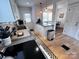 Bright kitchen with stainless steel appliances, white cabinets, and a functional layout at 4317 Ruskin Dr, Charlotte, NC 28209