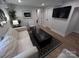 Inviting living room with comfortable sofa, modern decor, and a large television at 4317 Ruskin Dr, Charlotte, NC 28209