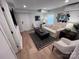 Cozy living room featuring a modern black and white rug, comfortable sofa, and stylish decor at 4317 Ruskin Dr, Charlotte, NC 28209