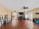 Bonus room with hardwood floors, natural light, and a ceiling fan at 4540 Hounds Run Dr, Matthews, NC 28105