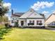 Charming one-story home featuring manicured front lawn and colorful landscaping at 4540 Hounds Run Dr, Matthews, NC 28105