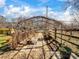 A charming greenhouse structure in the backyard with a stone paver walkway and metal support beams at 4540 Hounds Run Dr, Matthews, NC 28105