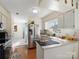 Bright kitchen with stainless steel appliances, white cabinets, and a view to the dining area at 4540 Hounds Run Dr, Matthews, NC 28105