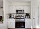 This kitchen features a white color palette with an oven and microwave at 4540 Hounds Run Dr, Matthews, NC 28105