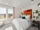 Well-lit bedroom features a large window, plush carpet, and modern decor at 5005 Kellaher Pl, Charlotte, NC 28216