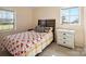 Comfortable bedroom featuring a decorative bed, neutral paint, vinyl floors, and a window at 506 Bond St, Cherryville, NC 28021