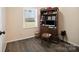 Cozy bedroom featuring a window offering natural light and a built-in desk with storage at 506 Bond St, Cherryville, NC 28021
