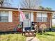 Charming brick home featuring a welcoming front entrance with a screen door at 506 Bond St, Cherryville, NC 28021