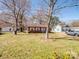 Charming single-story brick home with a well-maintained lawn and mature trees in a quiet neighborhood at 506 Bond St, Cherryville, NC 28021