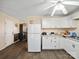 Kitchen featuring white cabinets, vinyl floors, neutral paint, and stainless steel appliances at 506 Bond St, Cherryville, NC 28021
