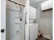 Well-equipped laundry area featuring a shower and stacked washer and dryer at 506 Bond St, Cherryville, NC 28021
