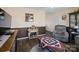 Cozy living room boasts vinyl floors, neutral paint, an accent wall, and comfortable seating at 506 Bond St, Cherryville, NC 28021